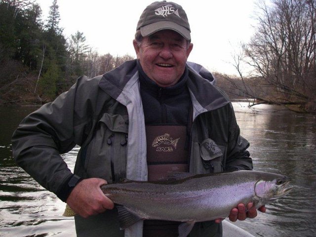 f1 005.jpg - Phil holding a big steelhead from the Manistee River in Michigan.
